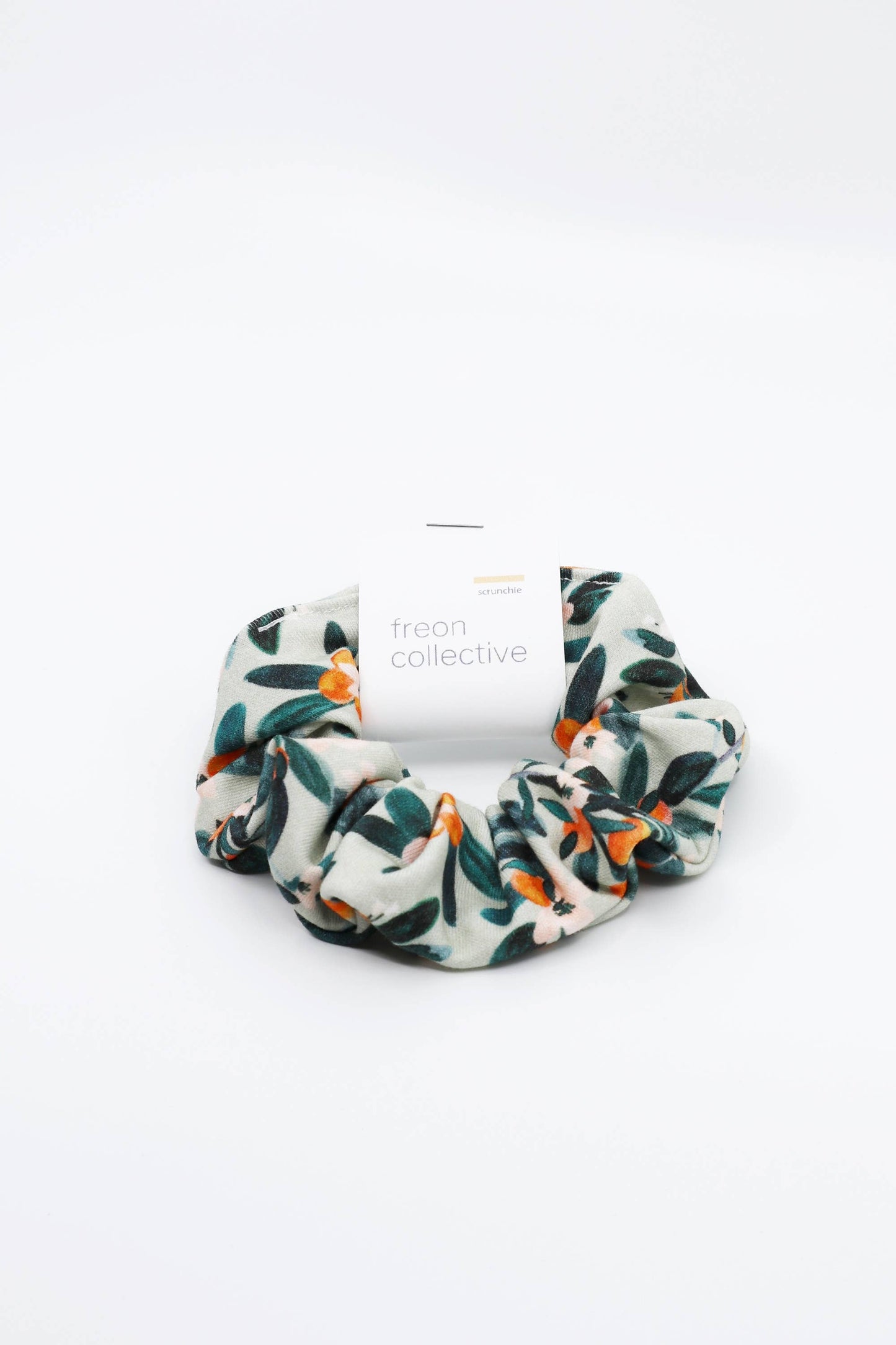 Freon Collective Hair Scrunchie with Sage Citrus Pattern. White Background.