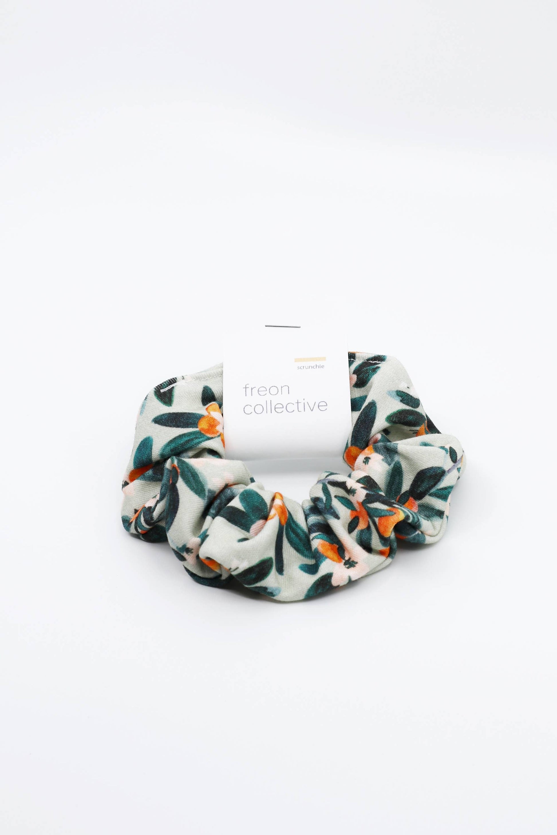 Freon Collective Hair Scrunchie with Sage Citrus Pattern.  White Background.