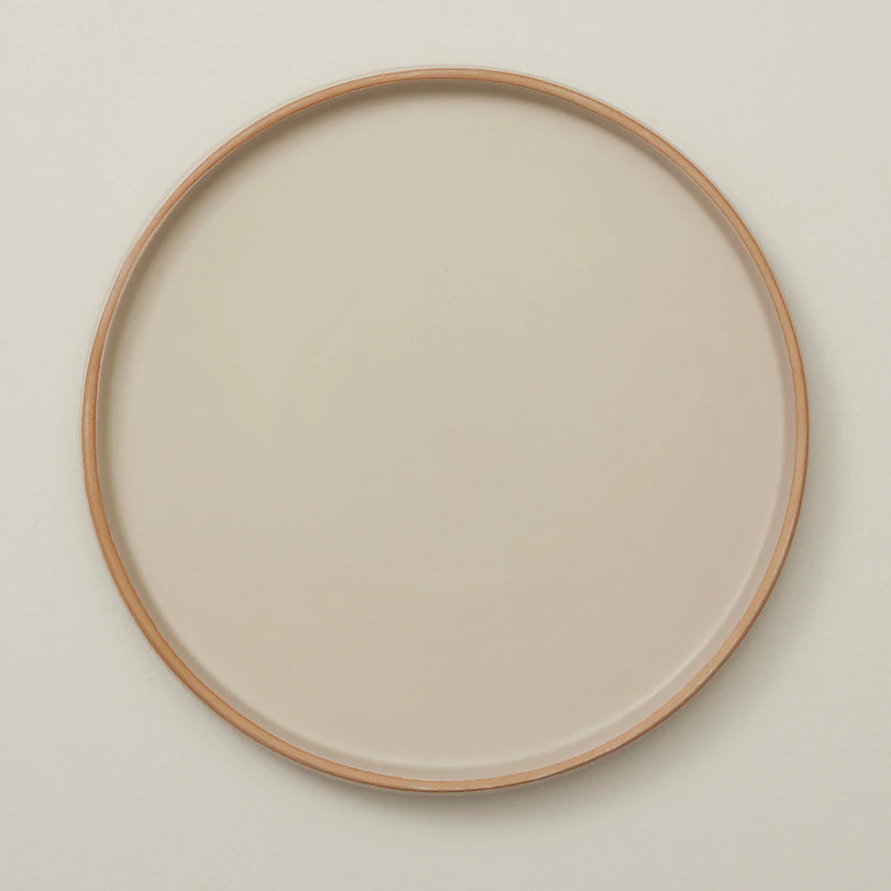 stoneware dinner plates with subtle ridged pattern and a matte mottled glaze.