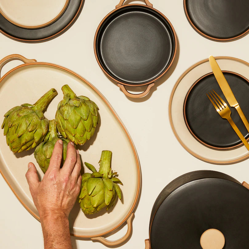 stoneware dinner plates with subtle ridged pattern and a matte mottled glaze.