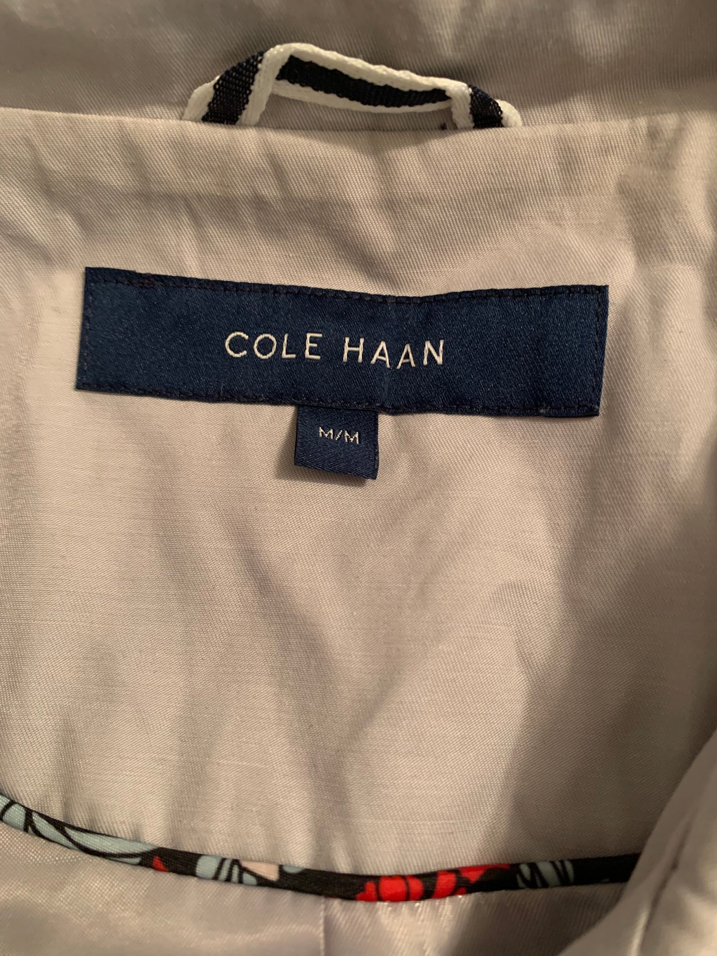 Grey Cole Haan Jacket in Size Medium. Close up photo of size and brand tag. 